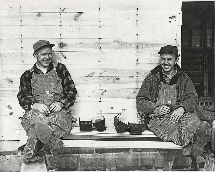 construction workers in an old black and white photo